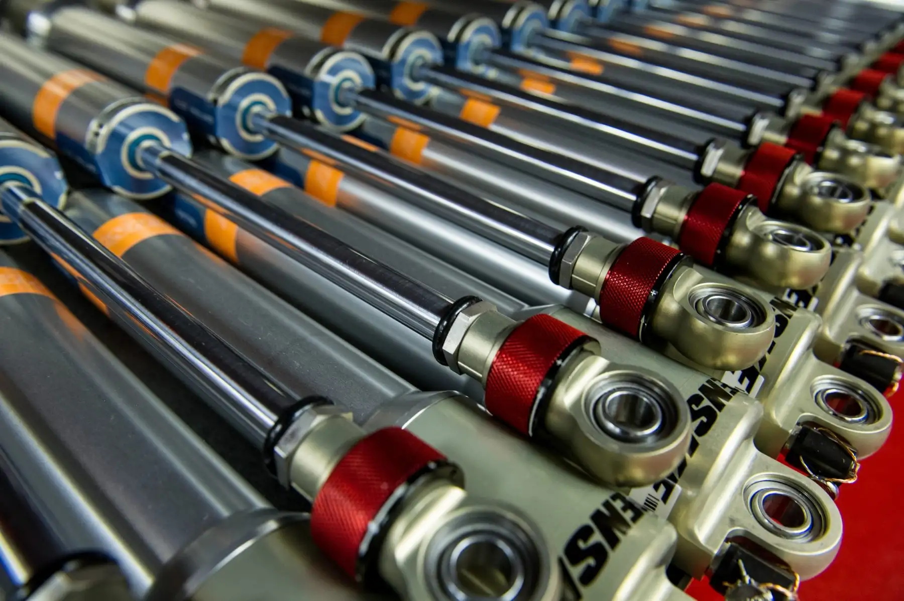 Rows of Penske racing shocks